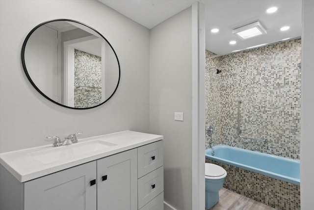 300 N State St Unit 5225, Chicago, IL 60654 - full bath with toilet, recessed lighting, wood finished floors, tiled shower / bath, and vanity