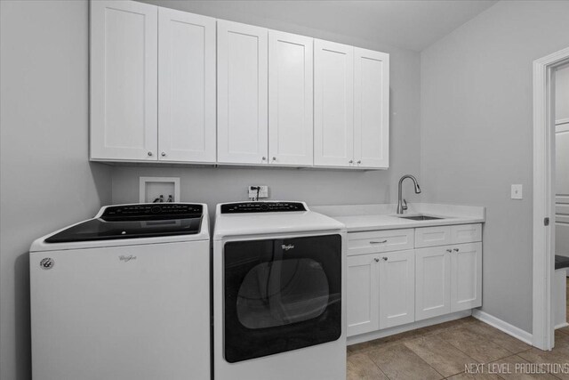 719 Foxborough Rd, South Elgin, IL 60177 - washroom featuring washing machine and clothes dryer, cabinet space, and baseboards