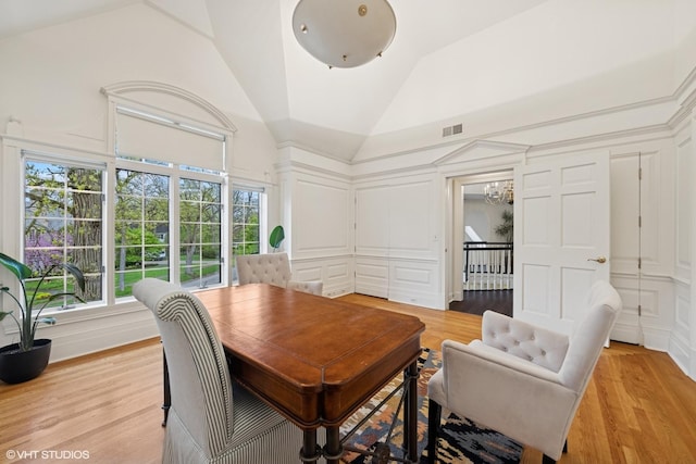 440 Woodside Ave, Hinsdale, IL 60521 - dining space with a decorative wall, light wood-style floors, and lofted ceiling