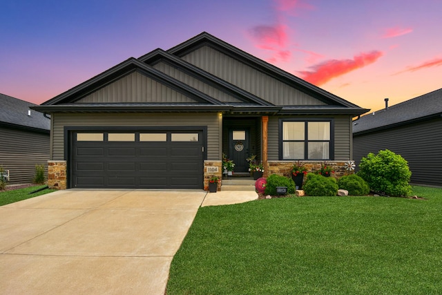 1104 Hershey Rd, Normal, IL 61761 - craftsman house with a yard, driveway, an attached garage, board and batten siding, and stone siding