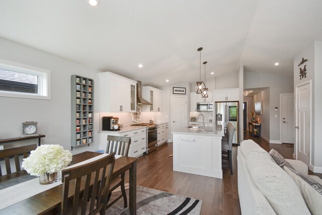 1104 Hershey Rd, Normal, IL 61761 - kitchen with appliances with stainless steel finishes, wall chimney exhaust hood, light countertops, backsplash, and white cabinets