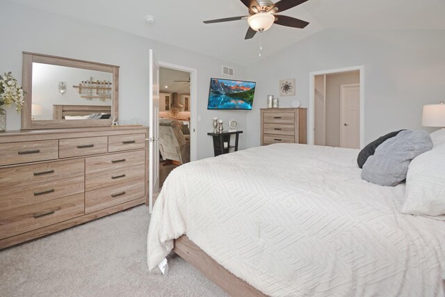 1104 Hershey Rd, Normal, IL 61761 - bedroom with light carpet, vaulted ceiling, ceiling fan, and ensuite bathroom