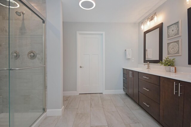 1104 Hershey Rd, Normal, IL 61761 - full bath with double vanity, a stall shower, and marble look tile flooring