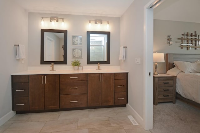 1104 Hershey Rd, Normal, IL 61761 - bathroom featuring double vanity and ensuite bathroom