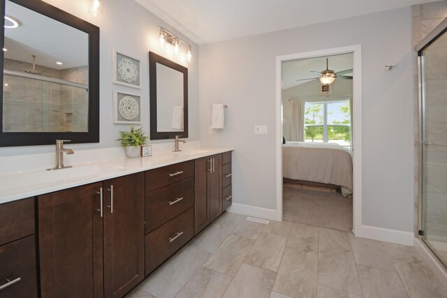1104 Hershey Rd, Normal, IL 61761 - full bath featuring double vanity, a stall shower, ceiling fan, ensuite bath, and marble look tile flooring