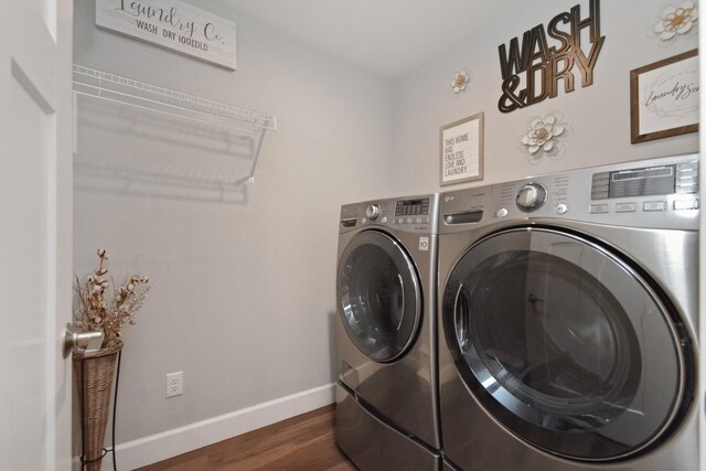 1104 Hershey Rd, Normal, IL 61761 - washroom featuring washer and dryer and dark wood-type flooring