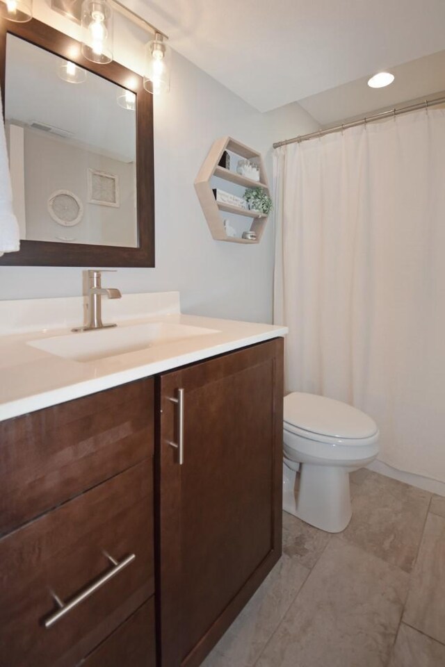 1104 Hershey Rd, Normal, IL 61761 - bathroom featuring vanity and toilet