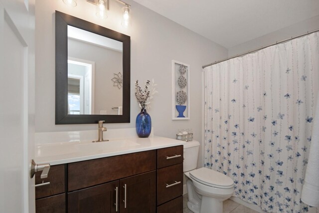 1104 Hershey Rd, Normal, IL 61761 - bathroom with vanity, tile patterned floors, and a shower with curtain