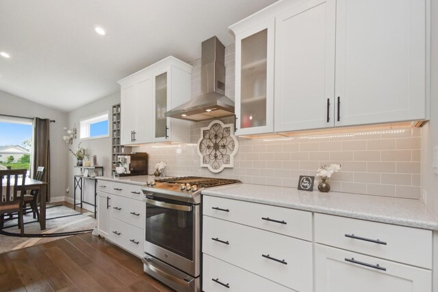1104 Hershey Rd, Normal, IL 61761 - kitchen with wall chimney exhaust hood, stainless steel gas range, vaulted ceiling, dark wood-style flooring, and tasteful backsplash