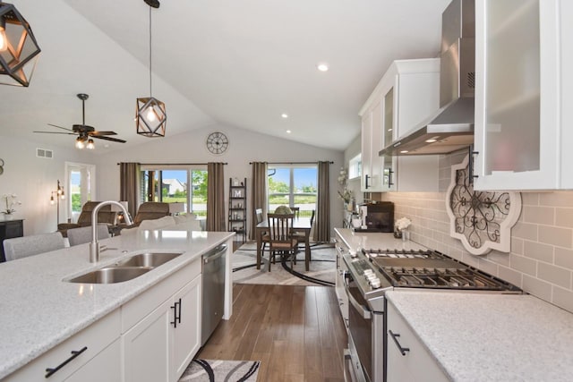 1104 Hershey Rd, Normal, IL 61761 - kitchen featuring stainless steel appliances, wall chimney range hood, dark wood-style floors, white cabinets, and lofted ceiling