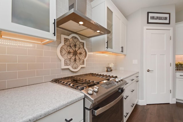 1104 Hershey Rd, Normal, IL 61761 - kitchen with gas stove, wall chimney range hood, tasteful backsplash, glass insert cabinets, and white cabinetry