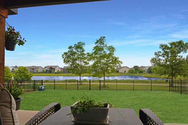 1104 Hershey Rd, Normal, IL 61761 - fenced backyard featuring a water view, a residential view, and a patio area