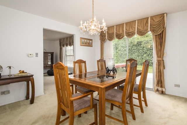 1504 Pfingsten Rd, Glenview, IL 60025 - dining area featuring light colored carpet, a chandelier, and healthy amount of natural light