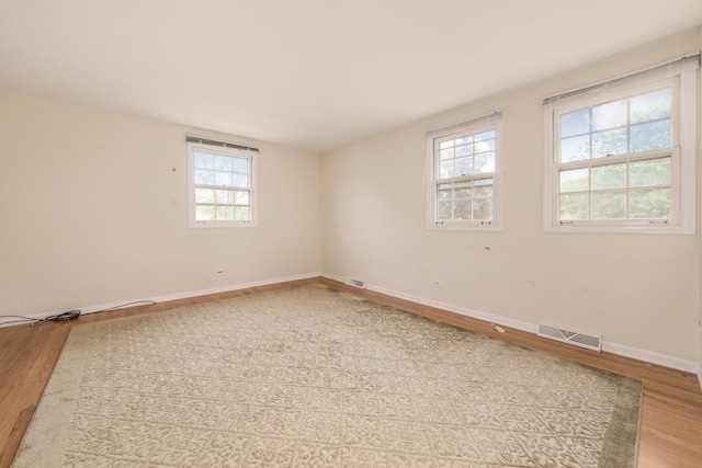 1504 Pfingsten Rd, Glenview, IL 60025 - empty room with wood finished floors and healthy amount of natural light