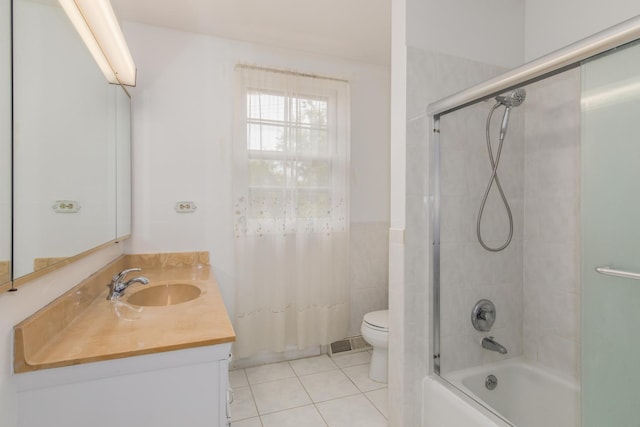 1504 Pfingsten Rd, Glenview, IL 60025 - bathroom featuring vanity, tile patterned floors, enclosed tub / shower combo, and tile walls