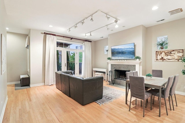 1347 W Washington Blvd Unit 2D, Chicago, IL 60607 - living room featuring a premium fireplace, light wood-type flooring, track lighting, and recessed lighting