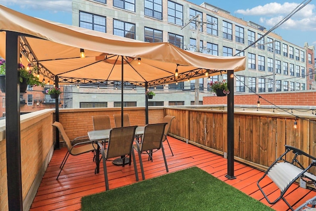 1347 W Washington Blvd Unit 2D, Chicago, IL 60607 - wooden terrace with outdoor dining space