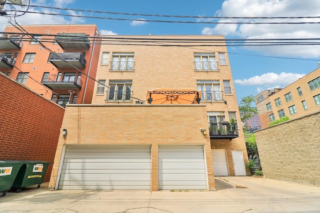 1347 W Washington Blvd Unit 2D, Chicago, IL 60607 - view of apartment building / complex with an attached garage and driveway