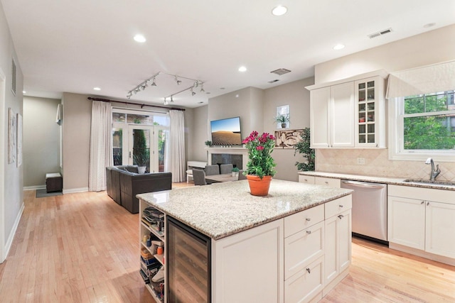 1347 W Washington Blvd Unit 2D, Chicago, IL 60607 - kitchen featuring dishwasher, wine cooler, a center island, healthy amount of natural light, and recessed lighting
