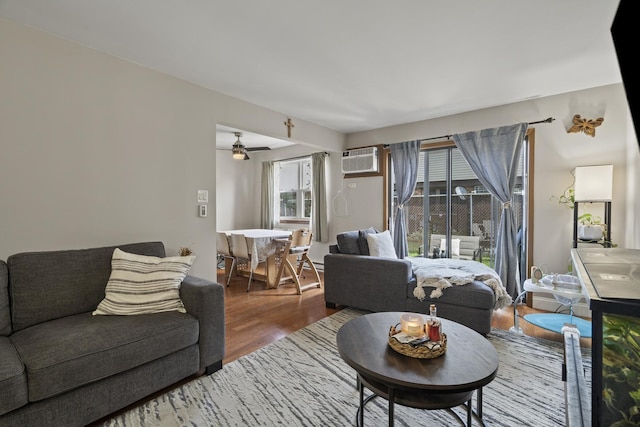 7250 W 84th St Unit C, Bridgeview, IL 60455 - living area featuring wood finished floors, a wall mounted AC, and ceiling fan