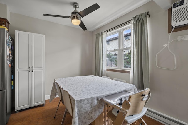 7250 W 84th St Unit C, Bridgeview, IL 60455 - dining space with baseboard heating, a ceiling fan, dark wood-style flooring, baseboards, and a wall mounted AC