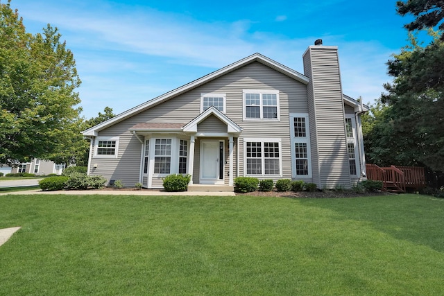 991 Willow St, Itasca, IL 60143 - view of front of house with a chimney and a front lawn
