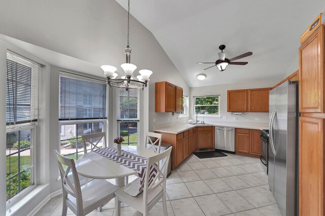 991 Willow St, Itasca, IL 60143 - kitchen featuring appliances with stainless steel finishes, lofted ceiling, a chandelier, light countertops, and brown cabinets