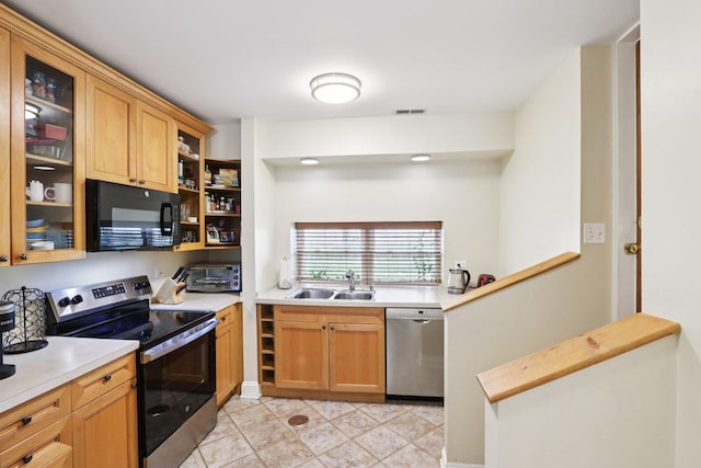 8911 Lamon Ave Unit A, Skokie, IL 60077 - kitchen with appliances with stainless steel finishes, light countertops, and glass insert cabinets