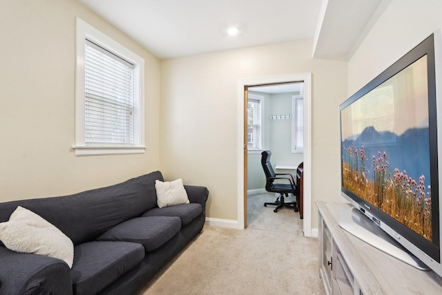 8911 Lamon Ave Unit A, Skokie, IL 60077 - living room with light colored carpet and a desk