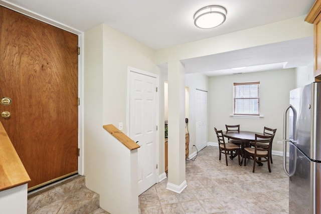 8911 Lamon Ave Unit A, Skokie, IL 60077 - dining area with baseboards and light tile patterned flooring