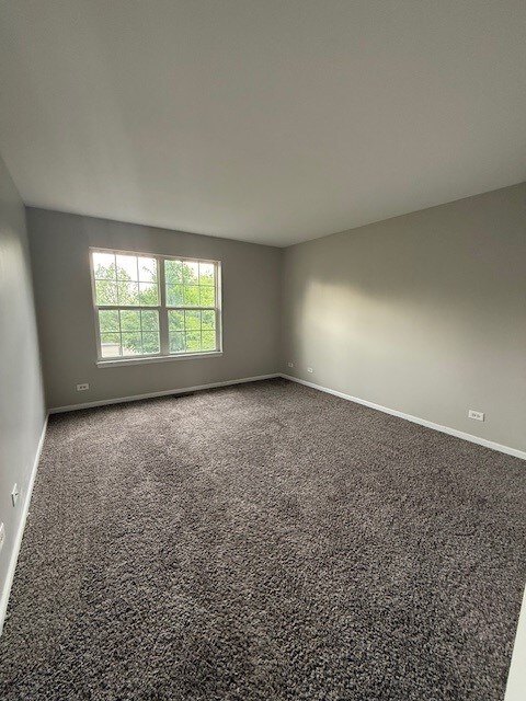 8307 Greenbridge Ct, Joliet, IL 60431 - unfurnished room featuring carpet flooring and baseboards