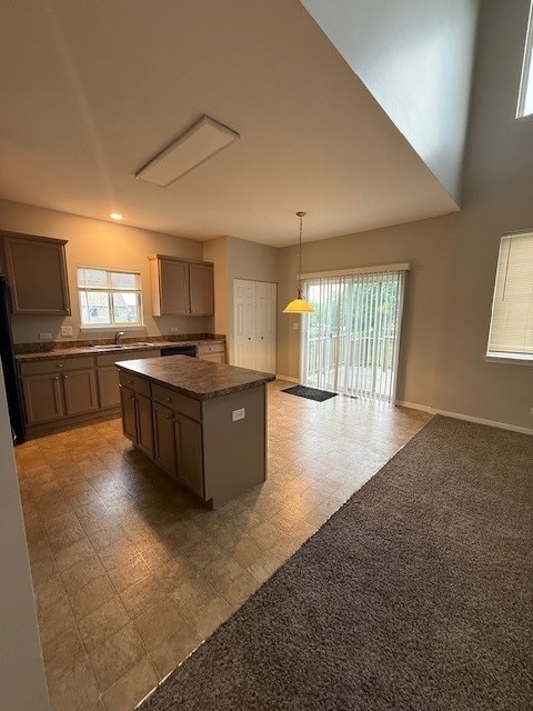 8307 Greenbridge Ct, Joliet, IL 60431 - kitchen featuring a center island, plenty of natural light, baseboards, decorative light fixtures, and recessed lighting