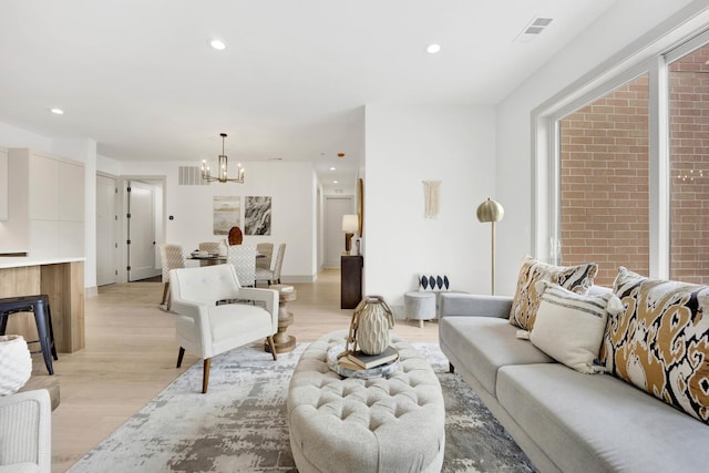 1548 W Ardmore Ave Unit 4C, Chicago, IL 60660 - living area with a chandelier, light wood finished floors, and recessed lighting