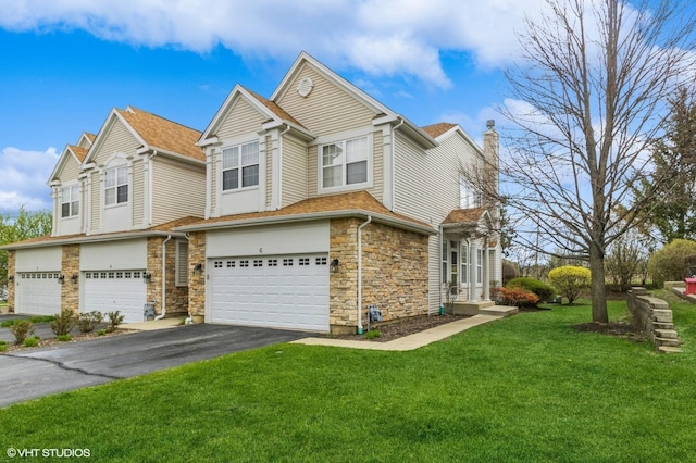 6 Clara Ct, Algonquin, IL 60102 - view of front of property with a garage, asphalt driveway, a front yard, a chimney, and stone siding