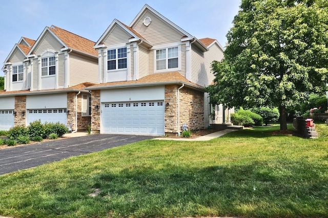 6 Clara Ct, Algonquin, IL 60102 - view of front of home featuring a garage, driveway, stone siding, and a front lawn