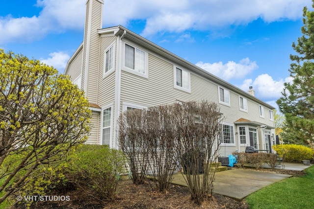 6 Clara Ct, Algonquin, IL 60102 - back of house with a chimney and a patio area