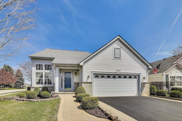 21436 W Larch Ct, Plainfield, IL 60544 - ranch-style home featuring asphalt driveway, brick siding, roof with shingles, and a garage