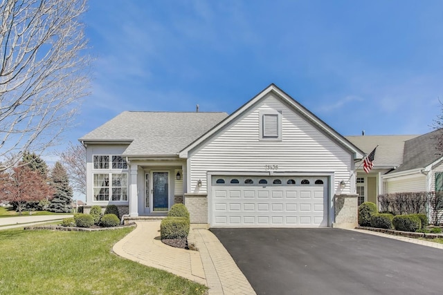 21436 W Larch Ct, Plainfield, IL 60544 - view of front of property featuring asphalt driveway, brick siding, an attached garage, a front lawn, and roof with shingles