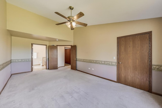 21436 W Larch Ct, Plainfield, IL 60544 - unfurnished bedroom featuring carpet floors, baseboards, connected bathroom, ceiling fan, and vaulted ceiling