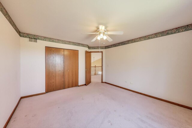 21436 W Larch Ct, Plainfield, IL 60544 - unfurnished bedroom featuring carpet, a closet, baseboards, and ceiling fan