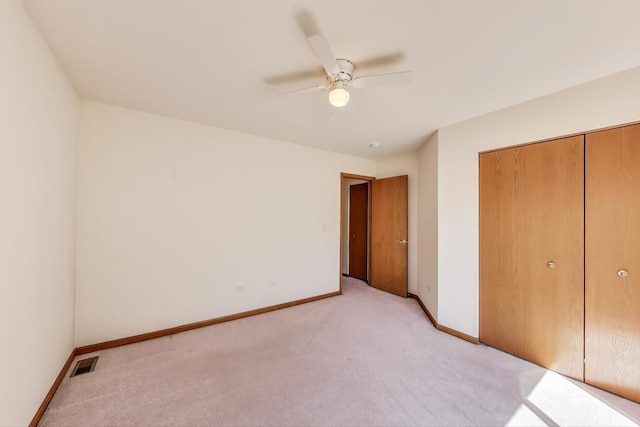 21436 W Larch Ct, Plainfield, IL 60544 - unfurnished bedroom with light carpet, a closet, baseboards, and ceiling fan