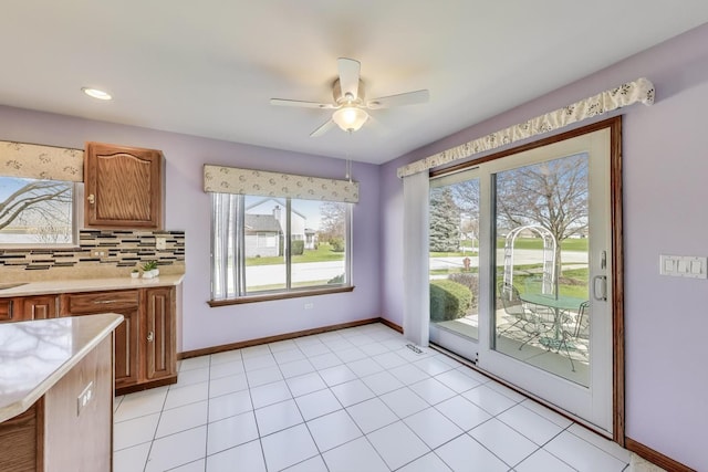 21436 W Larch Ct, Plainfield, IL 60544 - unfurnished dining area featuring baseboards and ceiling fan