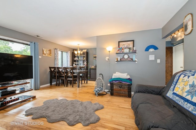 8473 Archer Ave Unit 204, Willow Springs, IL 60480 - living area with a chandelier and wood finished floors