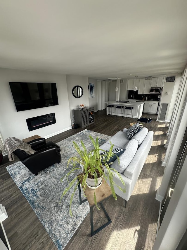 1 E Scott St Unit 1910, Chicago, IL 60610 - living room with dark wood-style floors and a fireplace