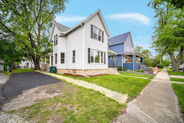 207 Iowa Ave, Joliet, IL 60433 - view of property exterior featuring a lawn and a porch