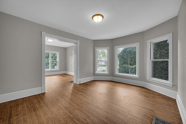 207 Iowa Ave, Joliet, IL 60433 - spare room with baseboards and hardwood / wood-style floors