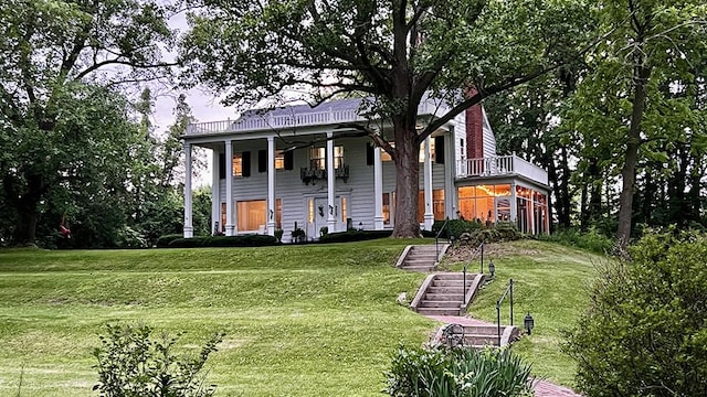644 Genesee Ave, Morrison, IL 61270 - neoclassical home featuring a front lawn and stairs