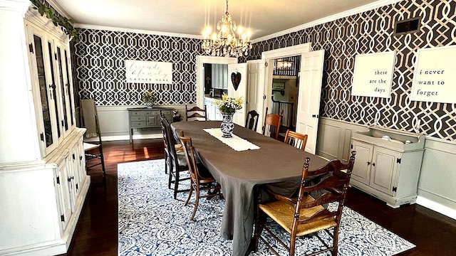 644 Genesee Ave, Morrison, IL 61270 - dining area with wallpapered walls, crown molding, a chandelier, dark wood finished floors, and wainscoting