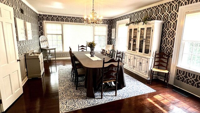 644 Genesee Ave, Morrison, IL 61270 - dining room with crown molding, wallpapered walls, dark wood-style floors, and a chandelier