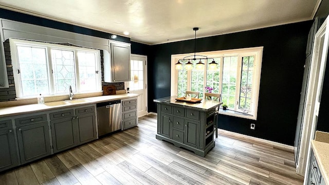 644 Genesee Ave, Morrison, IL 61270 - kitchen featuring dishwasher, light wood-style floors, light countertops, gray cabinetry, and hanging light fixtures